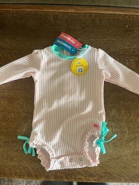 Ruffle Butts Pink and White Seersucker Romper with Teal Trim